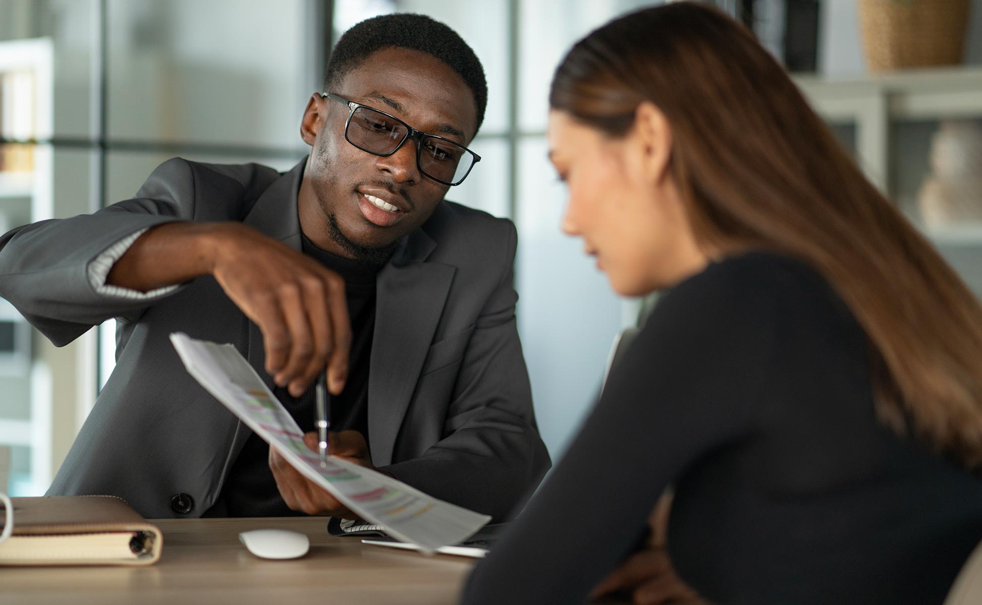 woman getting financial advice from credit union representative